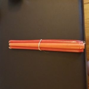 Bundle of rose red dinner candles